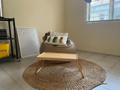 a coffee table sitting on top of a bean bag chair at Minyo Guest House in Jakarta