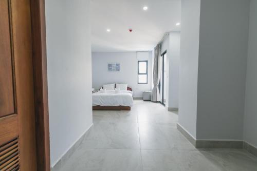 Ένα ή περισσότερα κρεβάτια σε δωμάτιο στο Residence 110 (Hotel and Apartments)