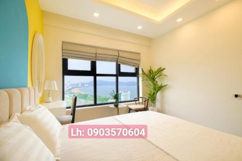 Postel nebo postele na pokoji v ubytování Quy Nhon Chillin' Apartment - FLC Sea Căn Hộ Hướng Biển Trung Tâm TP