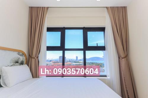 Postel nebo postele na pokoji v ubytování Quy Nhon Chillin' Apartment - FLC Sea Căn Hộ Hướng Biển Trung Tâm TP