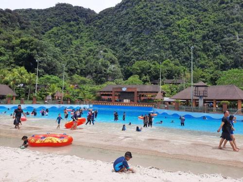 a group of people playing in the water at a beach at Sunway Onsen Theme Park View @Lost World of Tambun in Ipoh