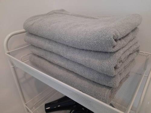 a pile of towels sitting on a shelf at Sunway Onsen Theme Park View @Lost World of Tambun in Ipoh