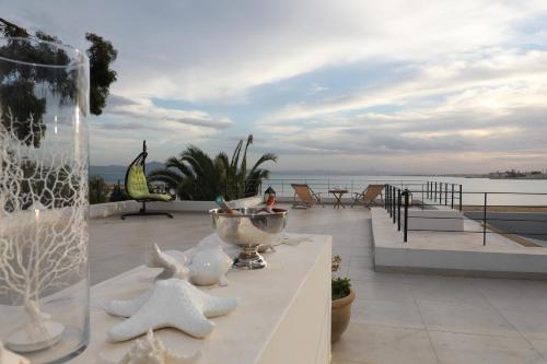 a balcony with a view of the water at La brise de Carthage: Earthly paradise in Carthage