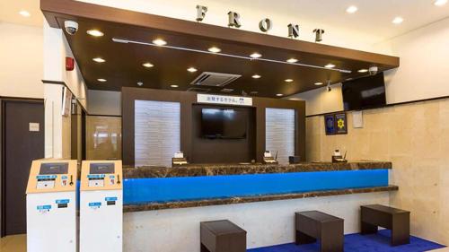 a lobby of a hotel with a reception counter at Toyoko Inn Tokyo Akabane-eki Higashi-guchi in Tokyo