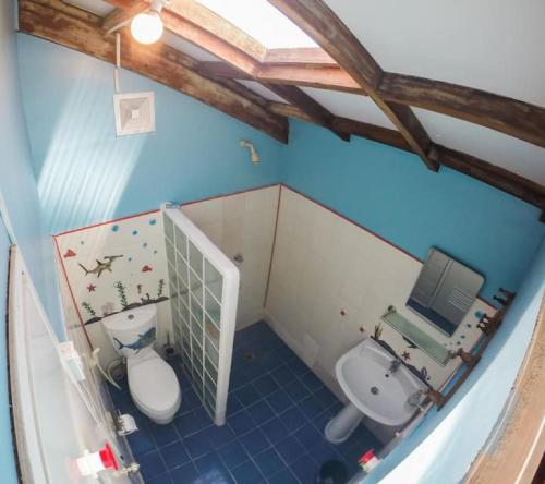 an overhead view of a bathroom with a toilet and sink at Threshershack Inn in Malapascua Island