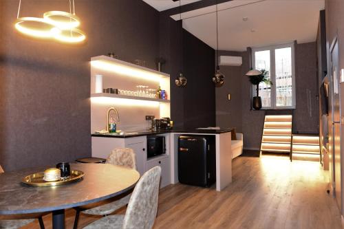 a kitchen and dining room with a table and chairs at SLEEP INN - Junior Suite 1 Private terrace in Antwerp