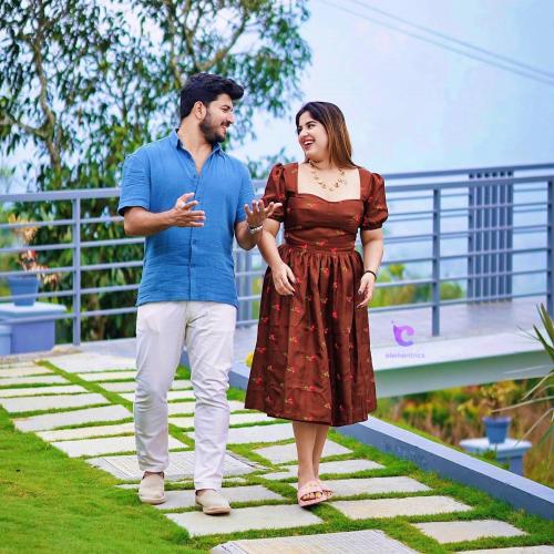 a man and a woman standing next to each other at The Windy Mist Resort Munnar in Chinnakanal