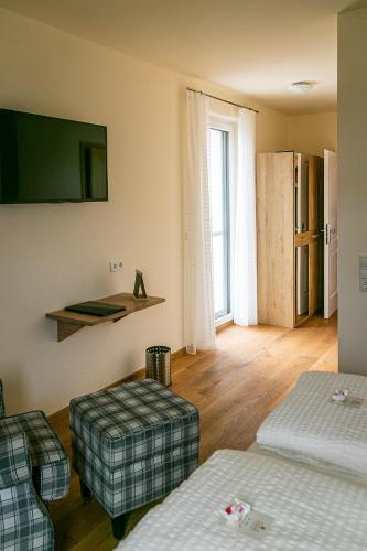 Ein Bett oder Betten in einem Zimmer der Unterkunft Weinhof Reichmann
