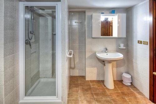 a bathroom with a sink and a shower at Agriturismo Casella Del Piano in Gubbio