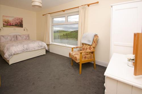 A bed or beds in a room at Cottage 171 - Clifden