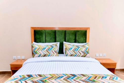 Ένα ή περισσότερα κρεβάτια σε δωμάτιο στο Zane Apartments in Rebero Heights