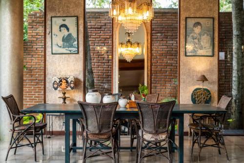 a dining room with a table and chairs at Villa Manis Beachfront Candidasa in Candidasa