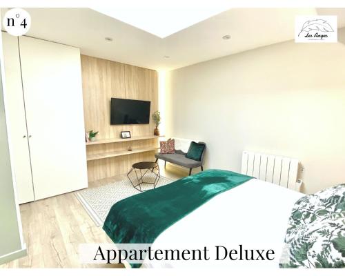 Les Anges - 6 appartements - Place des hérosにあるテレビまたはエンターテインメントセンター