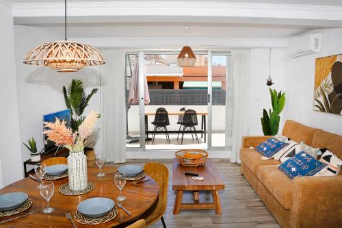 a living room with a couch and a table at M&C Penthouse Santa Barbara in Alicante
