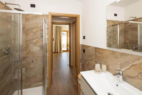 a bathroom with a shower and a sink at BAITA NOEMI in Livigno