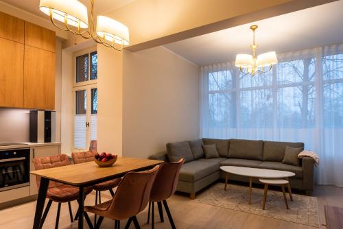 a living room with a couch and a table at Dorpat Apartment in Tartu