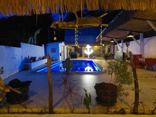 a swimming pool in a house at night at Baan sikhao Yanui in Rawai Beach