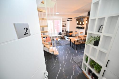 a room with a door open to a dining room at Apartmani Dimitrije Jahorina in Jahorina