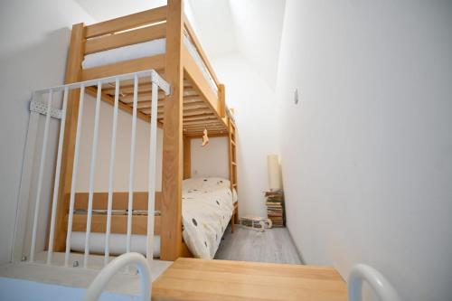 a small room with a bunk bed and a staircase at Apartmani Dimitrije Jahorina in Jahorina