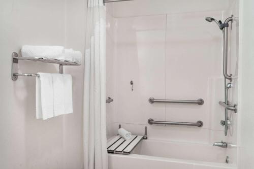 a bathroom with a shower and a bath tub at Super 8 by Wyndham Ukiah in Ukiah