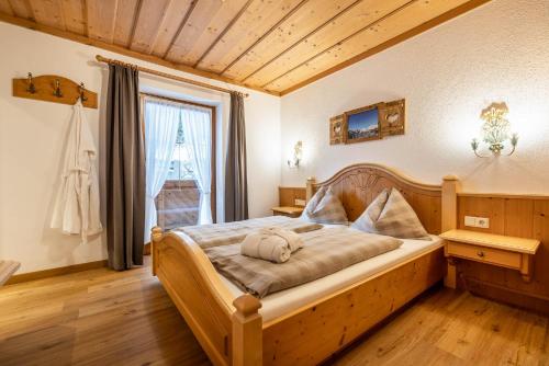 a bedroom with a large bed in a room at Das Geierberg in Filzmoos