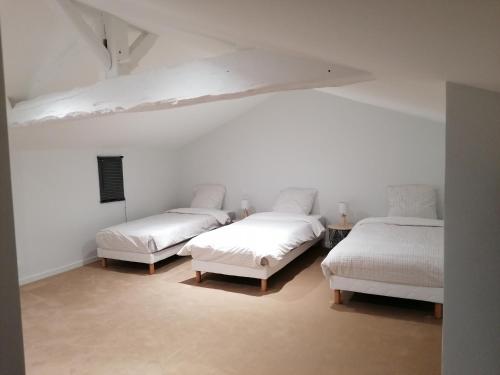 מיטה או מיטות בחדר ב-Étape Douessine