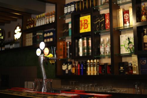 a bar with a faucet on top of a bar at HOTEL SOUTHERN HERITAGE in Udupi