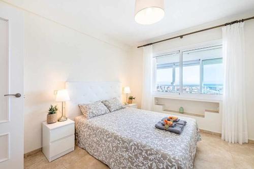 Posteľ alebo postele v izbe v ubytovaní 797 Holiday Rentals- Espectacular piso con vista al mar y al puerto