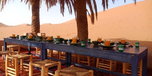 a blue table in the middle of the desert at Erg Chegaga Desert Night in El Gouera