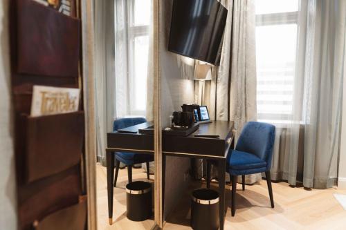 TV a/nebo společenská místnost v ubytování Hotel Bastian