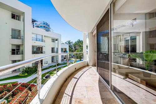 an apartment balcony with a view of a building at Nitta 104 in Nuevo Vallarta 