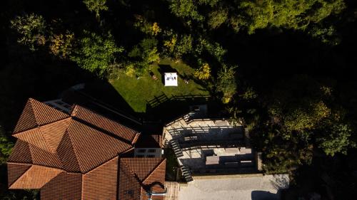 an overhead view of a house with a white house at Pyrgos Adrachti in Kalabaka