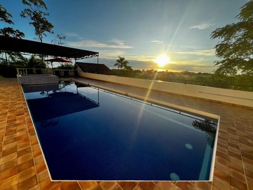 a swimming pool on the roof of a house at Hotel Los Cielos Del Caribe in Cahuita