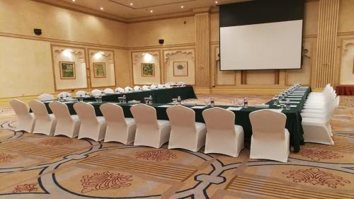 a conference room with a large table and chairs at Holiday Inn Al Khobar by IHG in Al Khobar