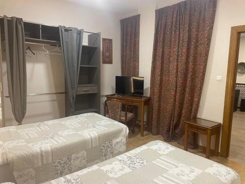 Ένα ή περισσότερα κρεβάτια σε δωμάτιο στο Hostal Costa Azul