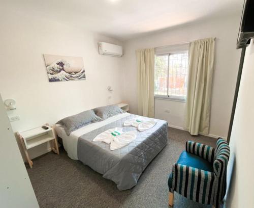 Ένα ή περισσότερα κρεβάτια σε δωμάτιο στο Aguila Blanca