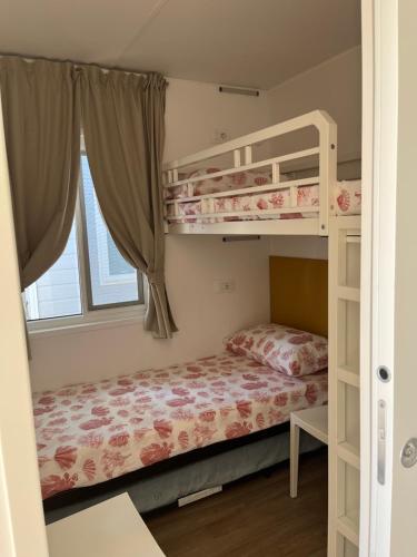 Posteľ alebo postele v izbe v ubytovaní Camping Village Torrenova