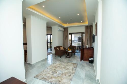 a living room with a couch and a table at AIFU Hotel El Montazah Alexandria in Alexandria