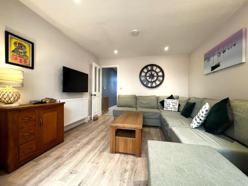 a living room with a couch and a table at York Street in Cowes