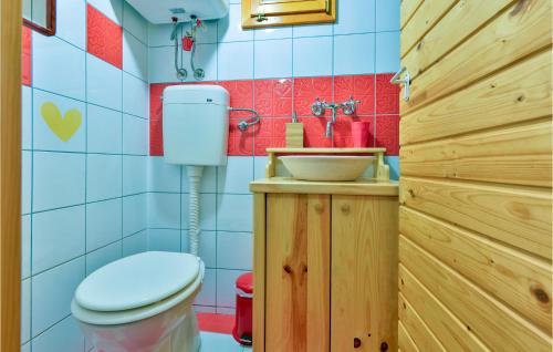 a bathroom with a toilet and a sink at 2 Bedroom Amazing Home In Lepoglava in Lepoglava