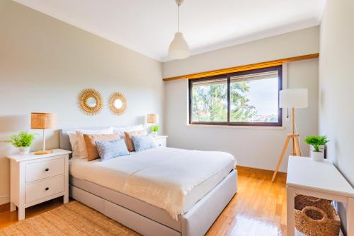 Postel nebo postele na pokoji v ubytování Cascais Family Retreat