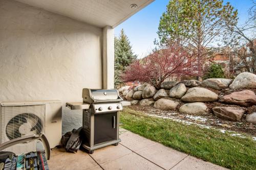 a stove and a grill sitting outside of a house at Arrowhead Ski Condo in Edwards
