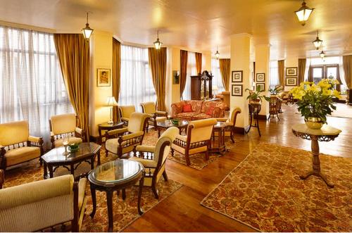 a large living room with couches and chairs at The Elgin Silver Oaks - Heritage Resort & Spa in Kalimpong