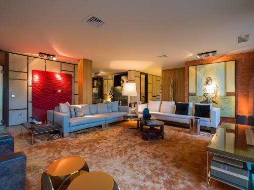 a large living room with white couches and tables at Villa Kai by Maspalomas Holiday Villas in Pasito Blanco