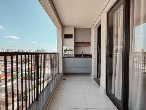 an apartment balcony with a view of a city at Condomínio Residencial Unique Residence - São José do Rio Preto in Sao Jose do Rio Preto