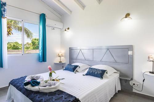 Postel nebo postele na pokoji v ubytování Les Villas de la Cheminée
