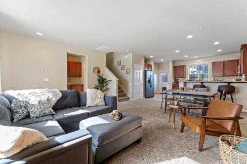 a living room with a couch and a table at High End Midtown Home With Fireplace And Ensuite Baths in Reno