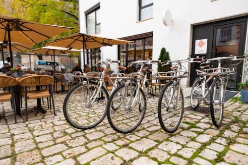 a group of bikes parked outside of a restaurant at Abbate Boutique Hotel in Ulm