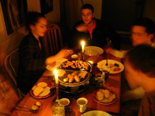 a group of people sitting around a table with a cake at Domaine Bellevie BnB in Vex