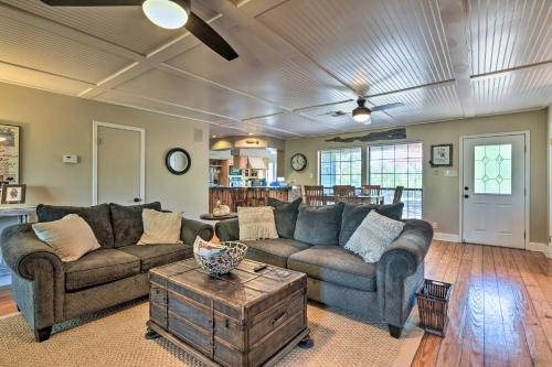 a living room with a couch and a table at Bay Access and Dock Riverfront Tivoli Escape in Tivoli
